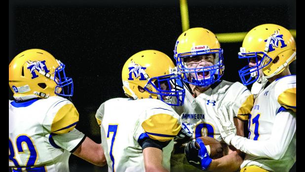 Photo for the Mascot by Brian Jeremiason AJ Myhre is congratulated after recovering a fumbled punt late in the game.