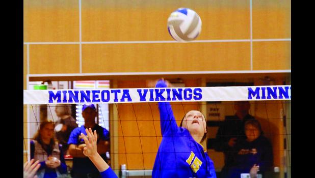 Staff Photo by Byron Higgin. Abby Frie came off the bench to hit for Minneota.