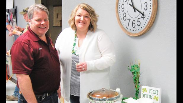 Mascot photo by Scott Thoma. Steve Traen and Angie Hulzebos with Irish stew.