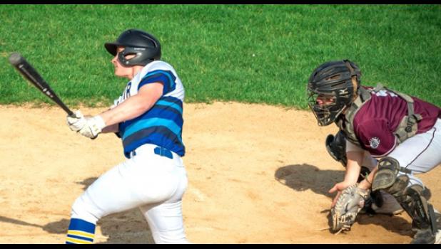 Mascot photo by Brian Jeremiason Isaac Pohlen of the Vikings laces a run-scoring single down the third-base line against Yellow Medicine East on Monday at K.P. Kompelien Field in Minneota.