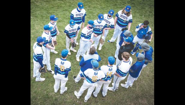 Mascot photo by Brian Jeremiason Minneota coach Keven Larson addresses his team between innings Friday at K.P. Kompelien Field in Minneota.