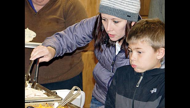 Photos for the Mascot by Sue Jacobson. Helping son Logan was Becky Esping.