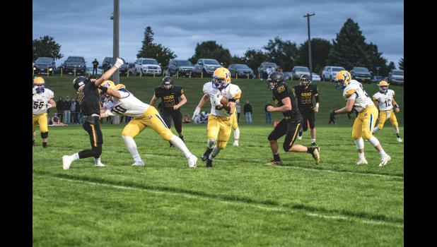 Photo for the Mascot by Brian Jeremiason. Blake Reiss followed a big block from Logan Sussner. Reiss had a big game for the Vikings.