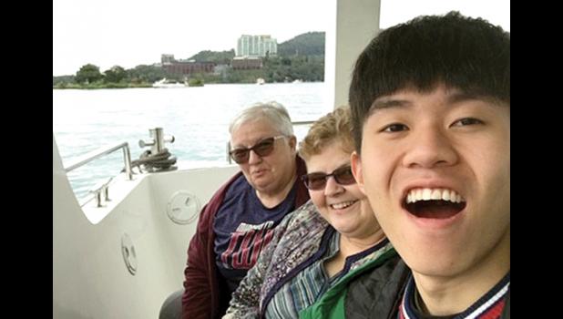 Special Photo. Brenda, Lori and Amos enjoy a boat ride together.