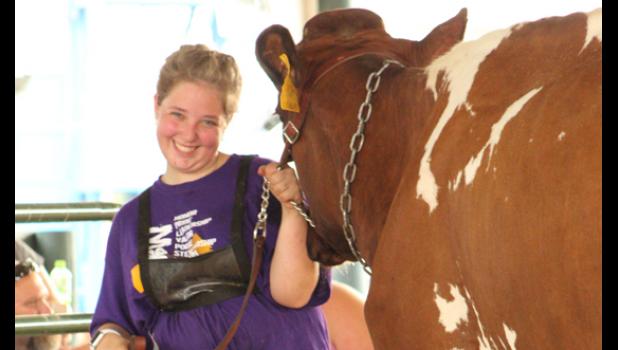 Contributed photo Brooke Moorse pauses for a smile during the 4-H dairy show at the Yellow Medicine County Fair.