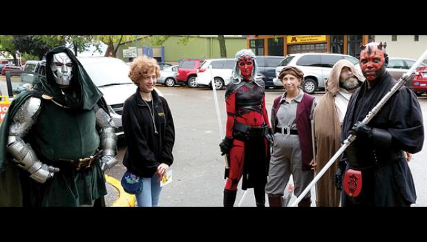 Staff Photo by Cherri Schmig. Doctor Doom character with Allison Johnson.