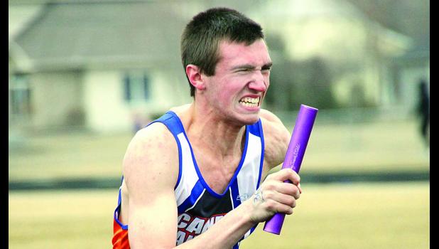 Staff Photo by Byron Higgin Carter Wente grimaces during the grueling 4x800-meter relay. Canby-Minneota finished second to Lac qui Parle Valley/Dawson-Boyd in this event.