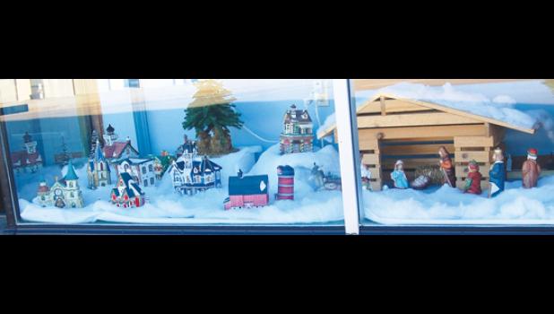 Mascot photo by Scott Thoma The front window at the Senior Center in Minneota was decked out with Dickens' Houses and a nativity scene for the holidays.