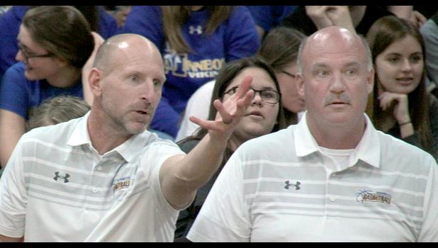 Staff Photo by Byron Higgin Coach Chad Johnston points to action on the floor as Assistant Coach Dale Kockleman looked on.