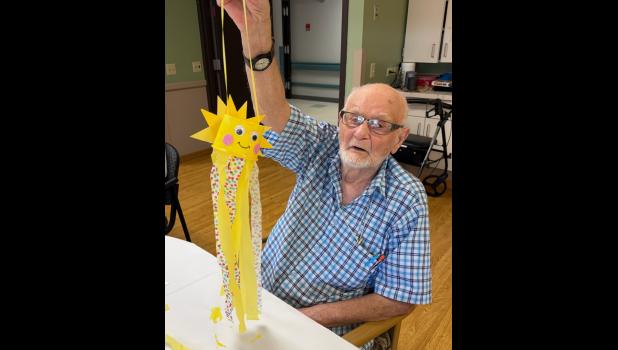 Minneota Assisted Living celebrated National Assisted iving Week with the theme “Shining Through the Years” from Sept. 12-19. Sam Waldner show his completed windsock. 