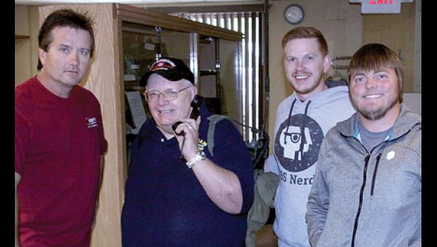 Photo for the Mascot by Royal Hettling. That’s me posing with the Pioneer Public Television crew that did the filming. They are: (left to right) Production Director Timothy Bakken, Ben Dempcy and Reese Prokosch.