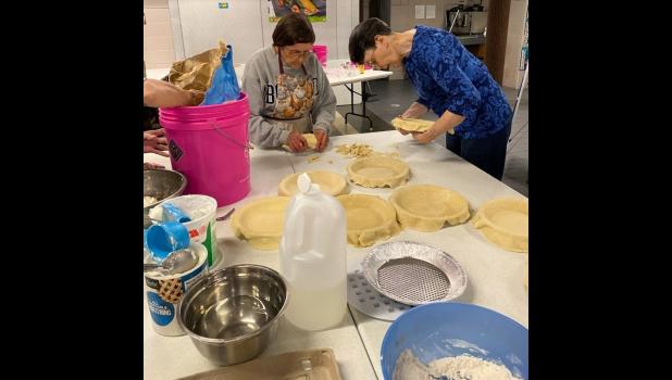 Contributed photo Barb Guttormsson, left, and Sue Johnson prepare pie crusts.