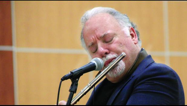 Staff Photo by Byron Higgin Denis DiBlasio on the flute.