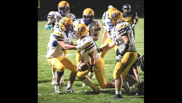 Mascot photo by Brian Jeremiason Lucas Rybinski (10) is congratulated by older brother, Anthony Rybinski (22) and other teammates after scoring against Dawson-Boyd last Wednesday night.