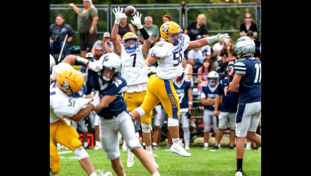 Minneota defensive lineman Sam Myhre intercepts a pass and returns it 27 yards for a touchdown in the second quarter. 