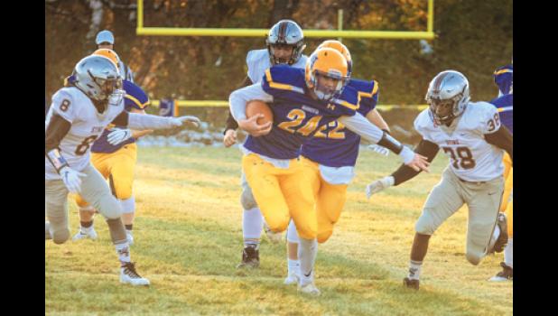 Photo for the Mascot by Brian Jeremiason. AJ Josephson breaks through for a first quarter touchdown.