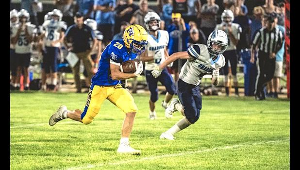 Gage Johnston breaks loose on his way to a 54-yard touchdown run last Thursday against Minnesota Valley Lutheran.