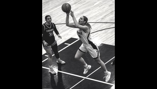 Mascot photo by Brian Jeremiason Kenadi Arndt drives to the basket and scores against RTR on Monday night.