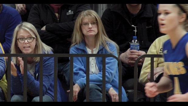 Staff Photo by Byron Higgin. Mother Diane Gillingham, clapped and cheered on her daughter Lizzy as she streaked up court during the Section 3A finals that sent the Minneota Vikings to the state.