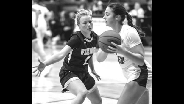 Mascot photo by Brian Jeremiason Grace Hennen, left, of Minneota defends against a Lac qui Parle Valley player last Friday night in Minneota.
