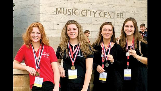 Special Photo. Taking home gold in Nashville were (left to right) Natalie Bot and Tara Thooft, with the silver going to Addie and Katie Konold.