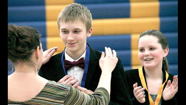 Staff Photo by Byron Higgin. A ribbon from Amanda Engels and a congratulations from Teagan Welsh was for Jacob Haen, who took first in Humourous Interpretation.