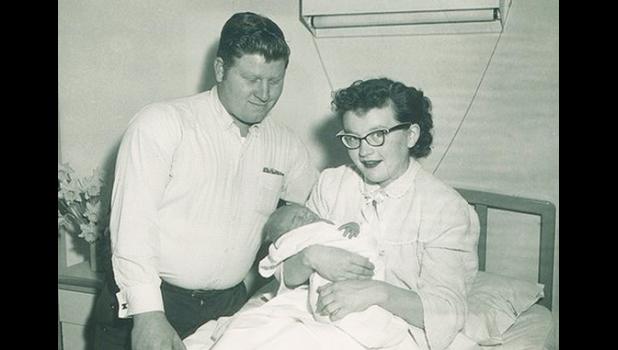 Contributed photo. Cliff and Darlene Hanson (now Sigurdson) pose with their New Year’s baby, Mark Hanson, in the Marshall Hospital on Jan. 1, 1957.
