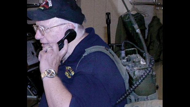 Photo for the Mascot by Royal Hettling. I show off the radio I carried for an entire year.