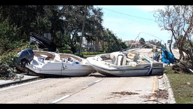Contributed photo After the floodwaters receded, these two boats were left in the middle of a road in Bonita Springs. Contributed photo