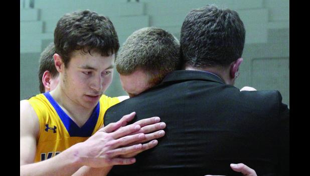 Staff Photo by Byron Higgin Isaac Hennen comforted Tate Varpness as the Lakeview star felt the pain and snuggled on his coaches shoulder.