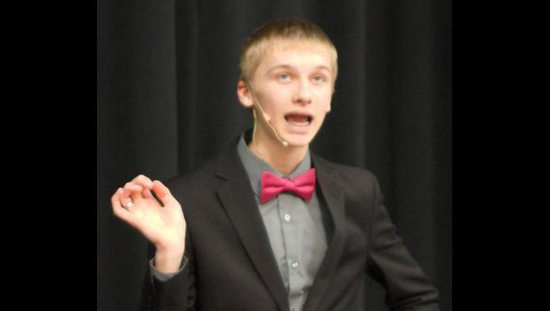 Photo for the Mascot by Sue Jacobson. During his Humourous speech, “Bible Camp the Musical,” Jacob Haen hit all the right notes.