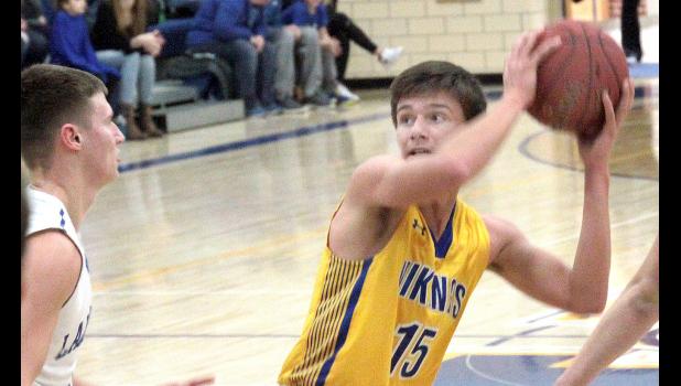Staff Photo by Byron Higgin. Jacob Hennen got into the lane with the ball Monday night against Lakeview.