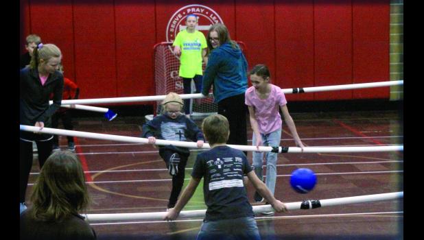 Staff Photo by Byron Higgin One of the events that did take place during Catholic Education Week was Human Foosball. All the kids got a "kick" out of the event.