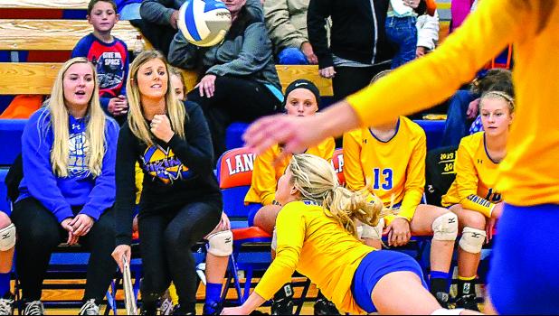 Photos for the Mascot by Brian Jeremiason. Lizzy Gillingham dove for the ball in front of Coach Hayley Fruin and her bench at Canby Tuesday night