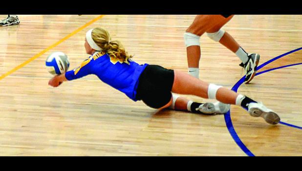 File Photo by Brian Jeremiason. Lizzy Gillingham stretches out to save the ball.