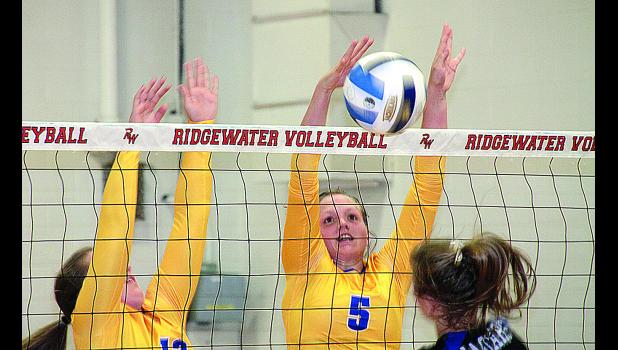 Staff Photo by Byron Higgin. Lydia Sussner blocked the ball back toward BBE. Help came from Sydney Larson (left).