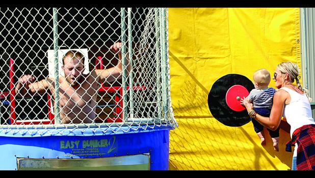 Photo for The Mascot by Laura Buysse Matt Buysse dunked by son Ryker, with help.