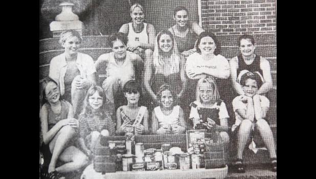 Miss Ghent and Little Miss Ghent candidates for 2001 sponsored a food drive for the Marshall Area Food Shelf on Sunday, July 22. First row, left to right: Jessa Roberts, Sabrina Polfliet, Megan McNeill, Holly Schroepfer, Candace Thooft and Anna Scherr. Middle row, left to right: Jamie Boerboom, Jenny Senden, Rachel Stiklestad, Krystal Maertens, Alisha Duthoy. Top row, left to right: Krista Senden and Brandy Chlebecek.