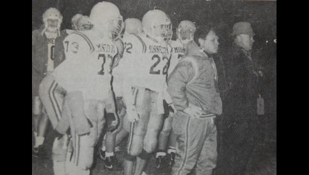 In this photo taken in November of 1989, the Minneota Vikings defeated Harmony 42-26 for the program’s 48th consecutive win. Looking on with the players is assistant coach Jim Rolbiecki and head coach Gerhard Meidt. The record was broken Friday, Sept, 19, 2026 when Minneota topped Canby 65-14 for the current program’s 49th straight victory.