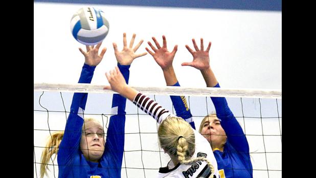 Photo from Mascot files Abby blockers. Abby Rost and Abby Hennen went to the net for a block.