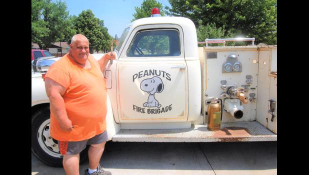 Mascot photo by Scott Thoma Dan "Peanuts" Kloos stands beside the 1948 fire truck he bought and plans to use for funerals of former local firemen.