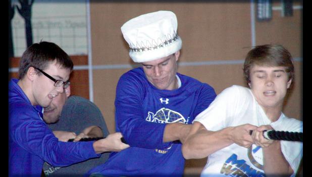 Staff Photo by Byron Higgin Seniors rope pull at homecoming.