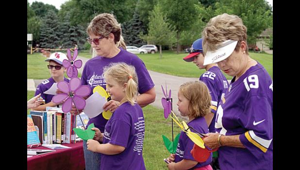Photo for the Mascot by Sue Jacobson. Checking out some of the information available at the Marshall-Lyon County Library were: (left to right) David Schuh, Mary Schlemmer, Brooklyn Debbaut, Jemma Gustafson, Alex Schuh and Doris Cool.