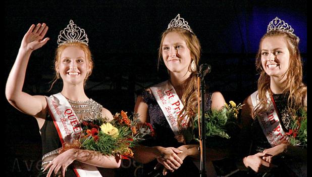 Staff Photo by Byron Higgin Queen Natalie Bot waved to the crowd with Princesses Katie Konold and Rachel Vlaminck alongside.