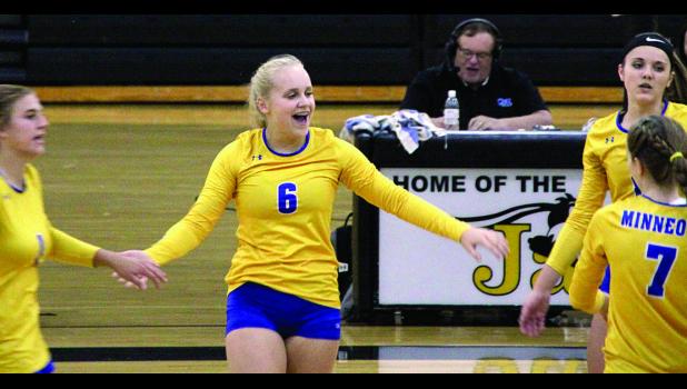 Staff Photo by Byron Higgin Minneota's Abby Rost celebrated during the Viking victory Thursday at Dawson. Abby Hennen was at the left with Natalee Rolbiecki and McKenna Yost.