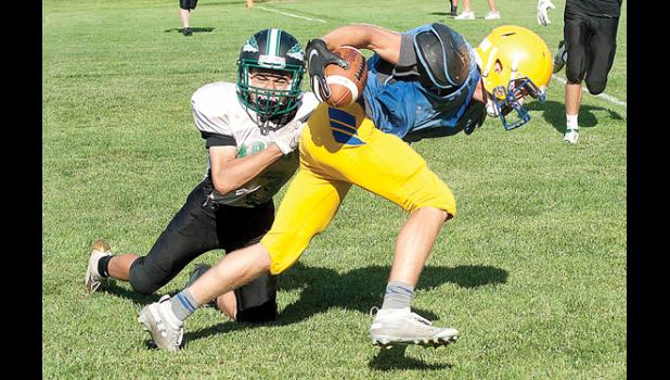 Photo for the Mascot by Per Peterson, Tracy Headlight-Herald. Minneota’s Blake Reiss had the ball tucked in as he ran past a Pipestone defender during the scrimmage in Tracy last Saturday. The Vikings will return to Tracy Thursday night to open the season against the Tracy-Milroy-Balaton Panthers.