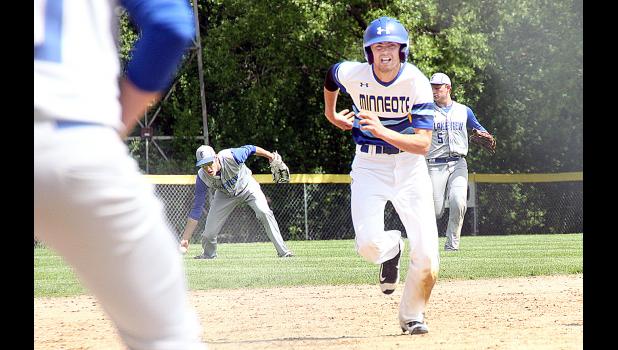 Minneota's Sam Buysse was running for this as if his feet were on fire. He got there and scored Minneota's first run of the game on a single by Teddy Pesch. Lakeview centerfielder Aaron Leinemann picked up the ball after Pesch's hit.