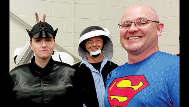 Staff Photo by Cherri Schmig. Nathan Schmig posing with some Star Wars characters.