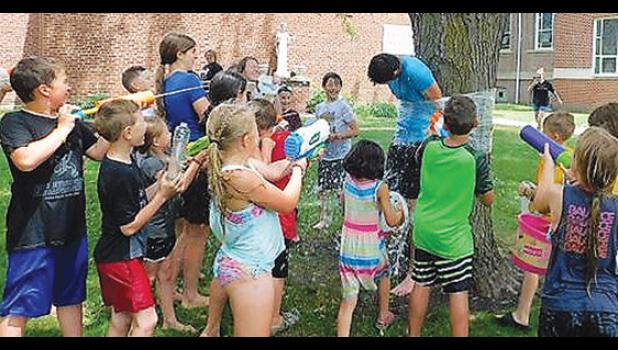 Contributed photo. Kids from St. Edward's celebrated Totus Tuus recently by playing games, water balloon toss, skits, learning, water fights and much more. Contributed photos