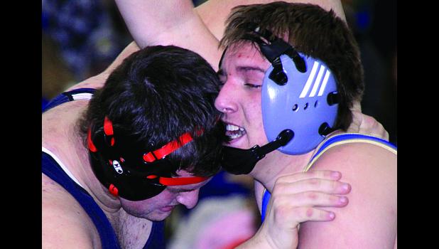 Staff Photo by Byron Higgin Trey Gronke (right) battled Hunter Cam of Worthington.
